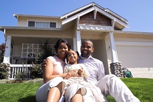 Family In Front of Home